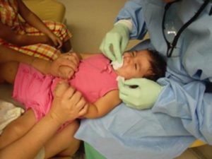 knee-to-knee dental exam